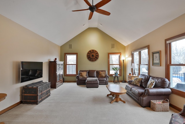 living room with high vaulted ceiling, light colored carpet, and ceiling fan