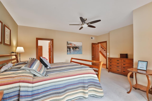 bedroom featuring ceiling fan and light colored carpet