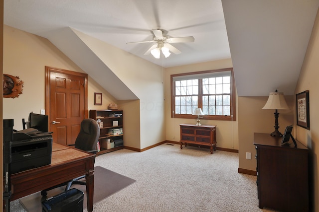 carpeted office featuring vaulted ceiling and ceiling fan