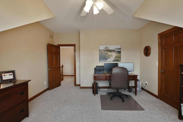 carpeted office space featuring ceiling fan