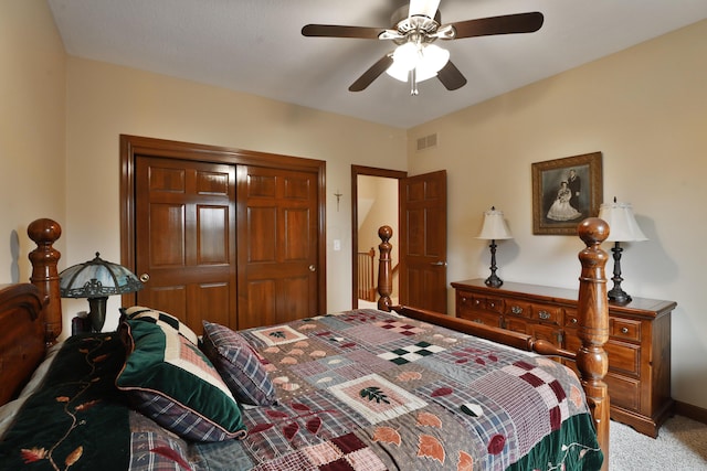 carpeted bedroom with ceiling fan and a closet