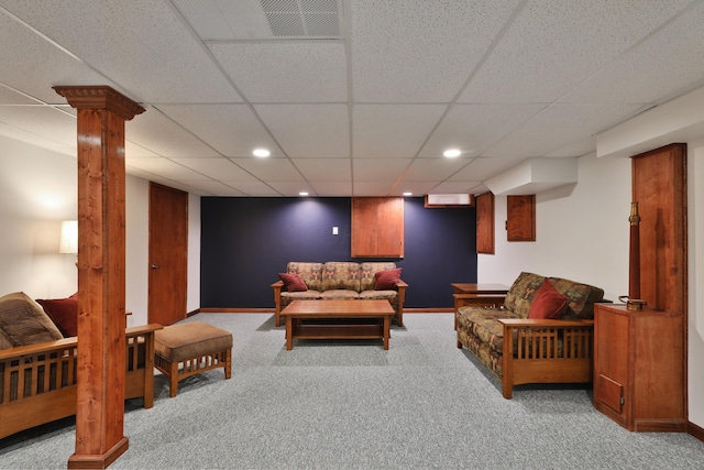 living room featuring decorative columns, a paneled ceiling, and light colored carpet