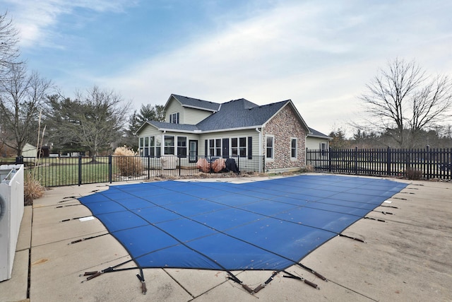 view of pool featuring a sunroom and a patio