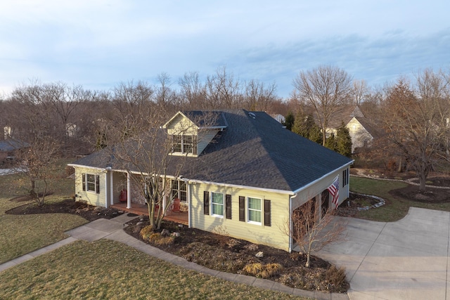 view of front of property featuring a garage and a front lawn