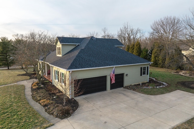 view of property exterior with a garage and a lawn