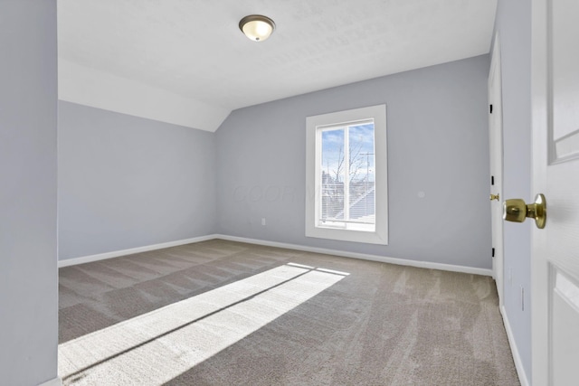 additional living space with light carpet and lofted ceiling