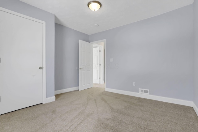 unfurnished bedroom with light carpet