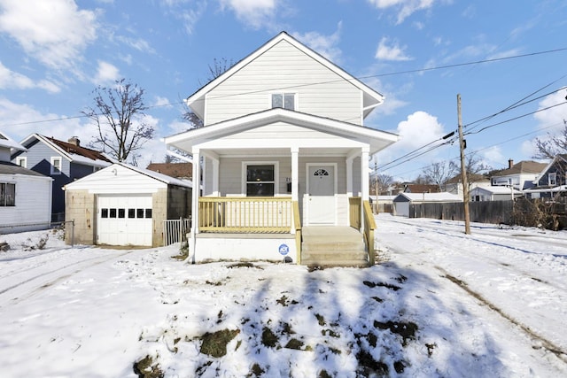 bungalow-style house featuring an outbuilding, a porch, and a garage