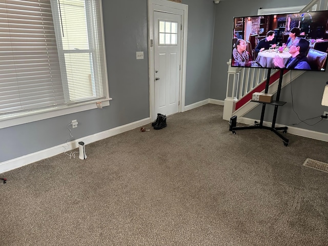 entrance foyer featuring carpet