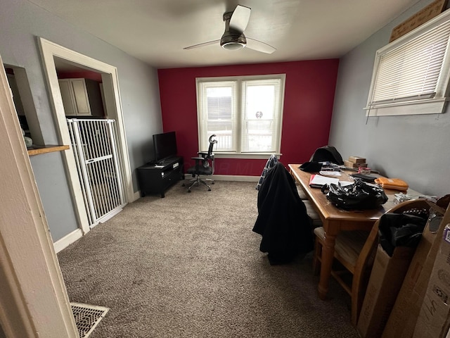 office space featuring carpet floors and ceiling fan