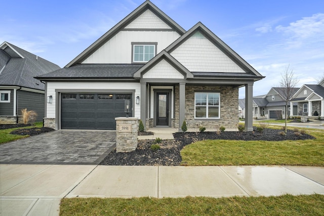 craftsman-style home featuring a front yard