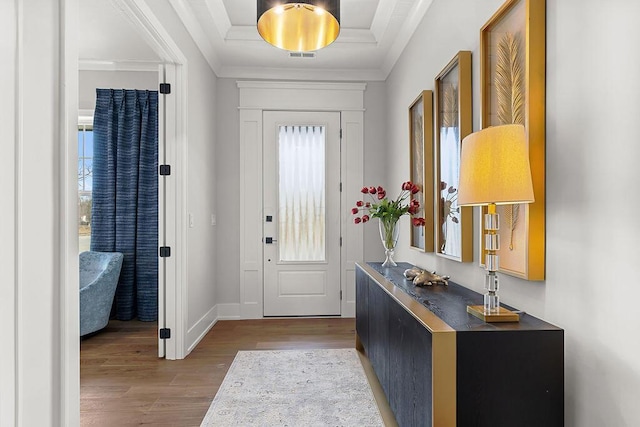 foyer with crown molding and wood-type flooring