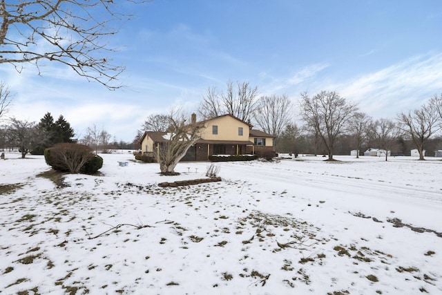 view of yard layered in snow