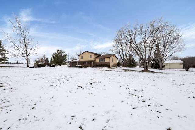 view of yard layered in snow