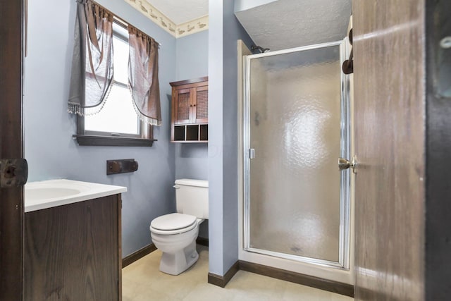 bathroom featuring vanity, toilet, a textured ceiling, and walk in shower