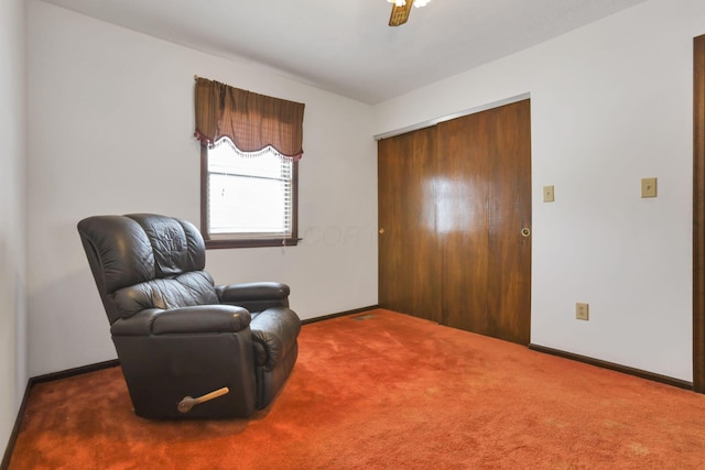 sitting room with carpet floors