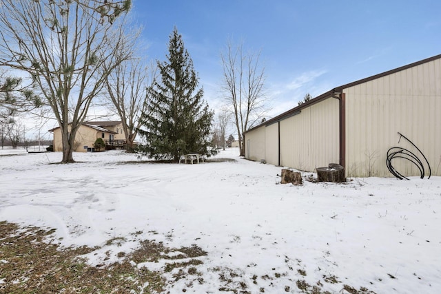 view of yard layered in snow