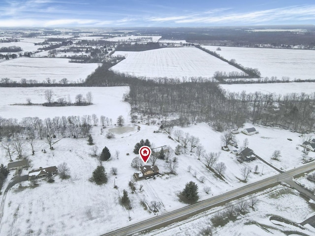 snowy aerial view featuring a rural view