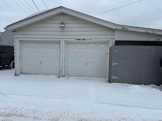 view of snow covered garage