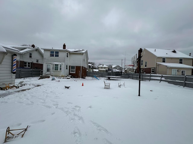 view of yard layered in snow