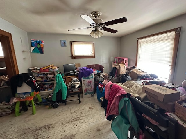 interior space with ceiling fan and a healthy amount of sunlight