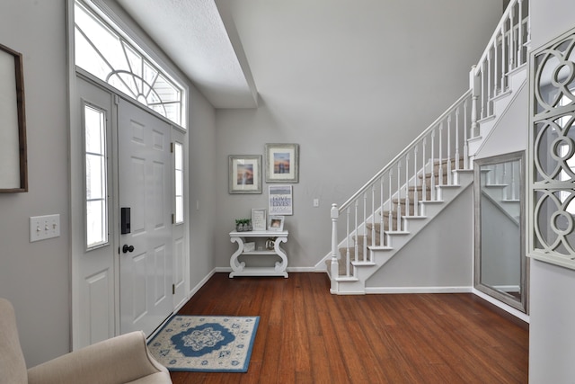 foyer with dark hardwood / wood-style flooring