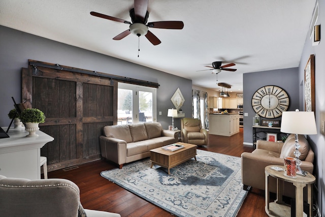 living room with ceiling fan, french doors, and dark hardwood / wood-style floors