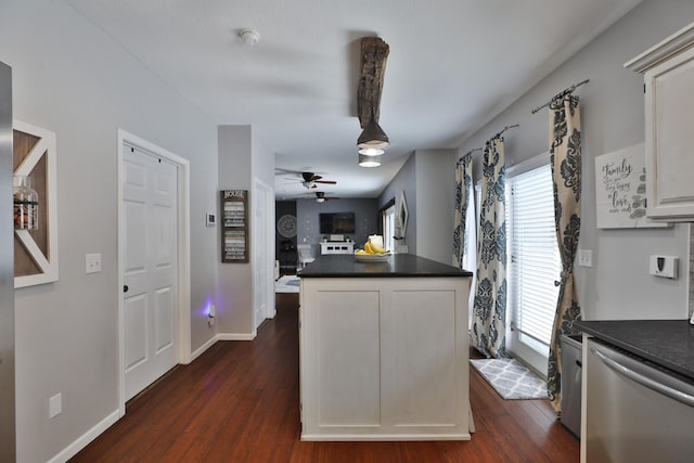 kitchen featuring dark hardwood / wood-style flooring, a healthy amount of sunlight, and dishwasher