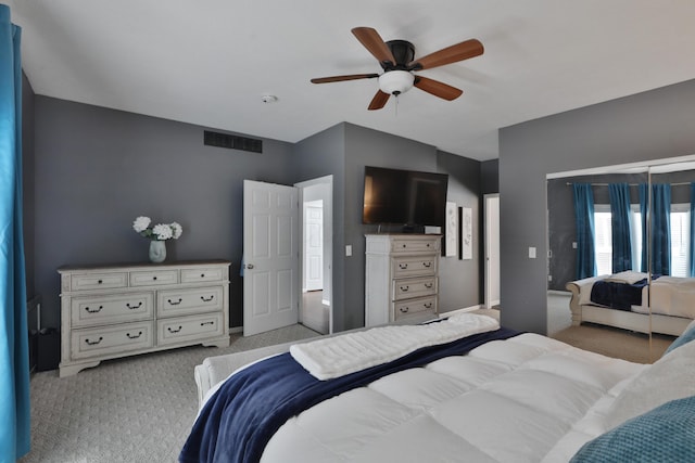 bedroom with ceiling fan and light colored carpet