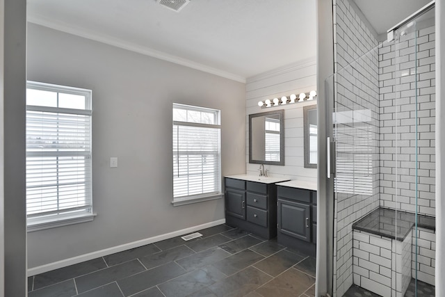 bathroom with crown molding, tile patterned floors, a shower with shower door, and vanity