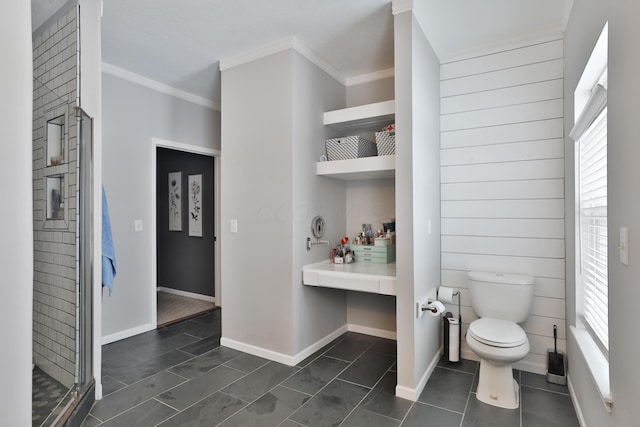 bathroom featuring toilet, tile patterned flooring, and crown molding