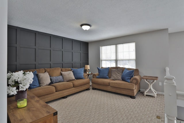 carpeted living room with a textured ceiling