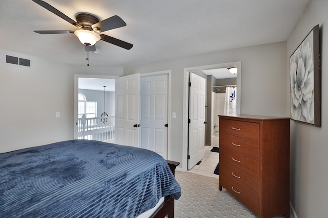 bedroom with light carpet and ceiling fan