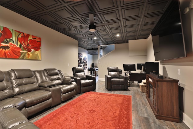 home theater room with hardwood / wood-style flooring