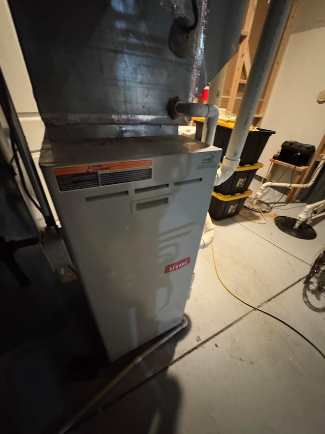 utility room with heating unit