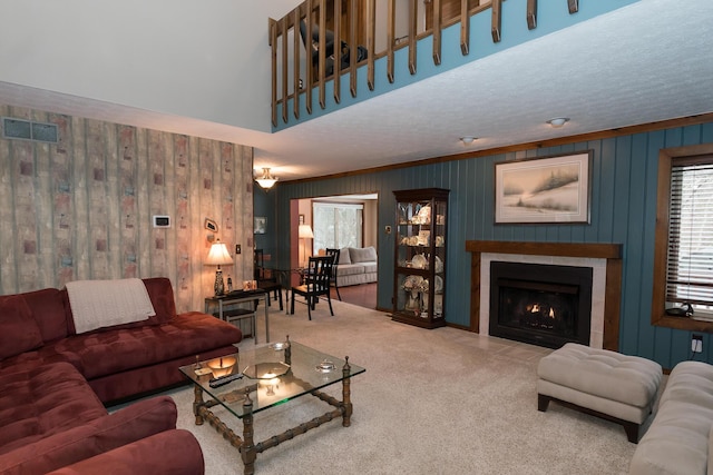 living room featuring a textured ceiling and carpet flooring