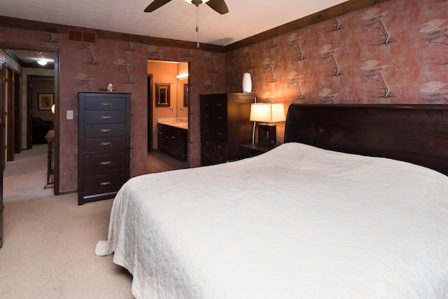 bedroom featuring ceiling fan, carpet, and connected bathroom