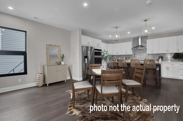 dining space with baseboards, visible vents, and dark wood finished floors