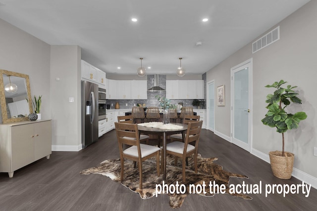 dining space featuring baseboards, visible vents, dark wood finished floors, and recessed lighting