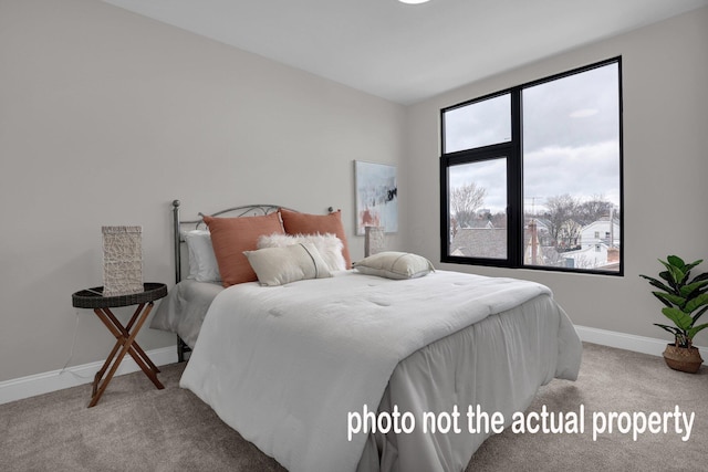 bedroom with carpet and baseboards