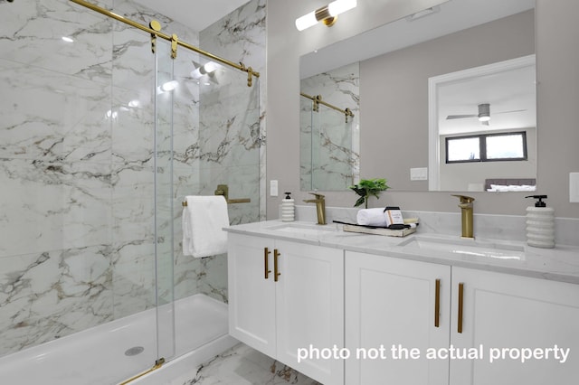 bathroom featuring marble finish floor, a sink, a marble finish shower, and double vanity