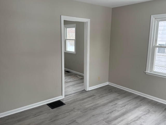 spare room with light hardwood / wood-style flooring