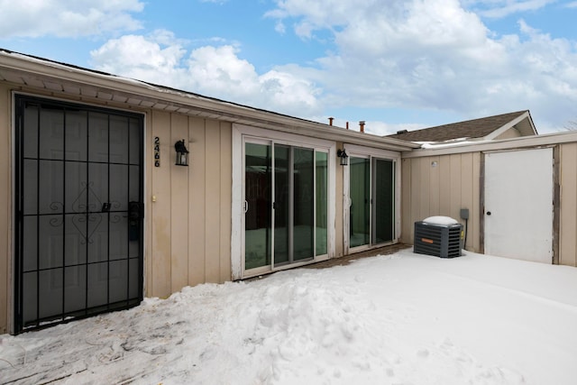 view of snow covered property entrance