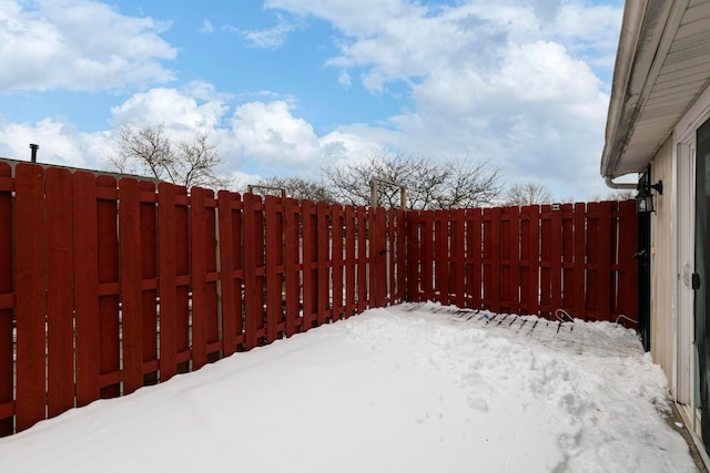 view of yard layered in snow