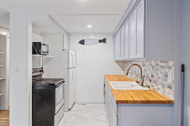 kitchen with sink, gray cabinetry, electric range, and backsplash