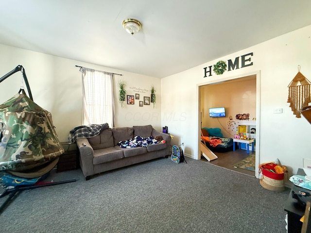 living room featuring dark carpet