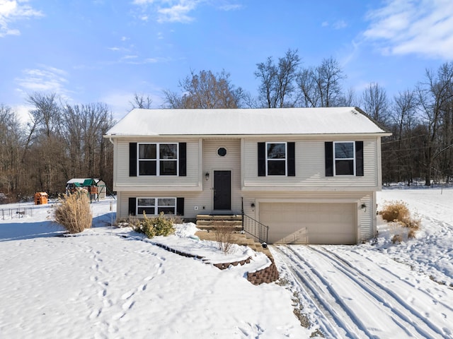 bi-level home featuring a garage