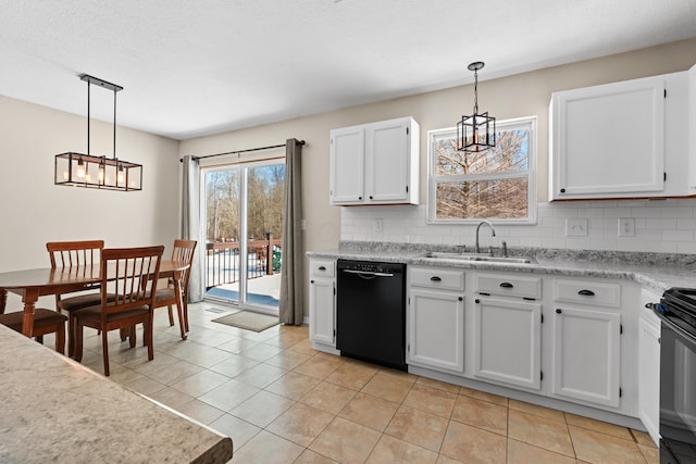 kitchen featuring decorative light fixtures, black appliances, tasteful backsplash, and white cabinetry