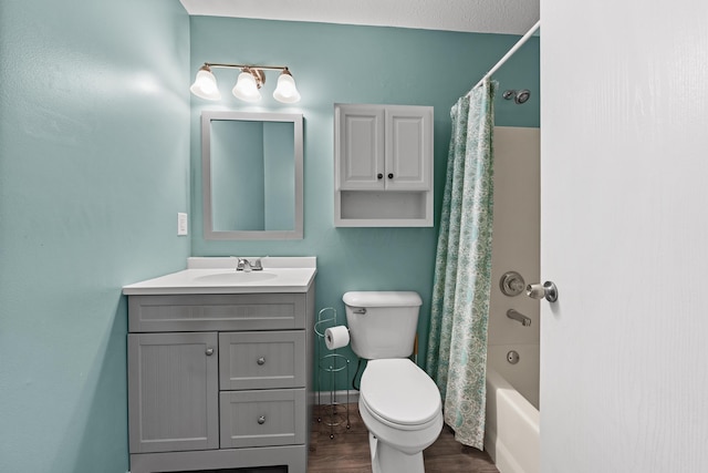 full bathroom featuring toilet, hardwood / wood-style floors, shower / tub combo with curtain, and vanity