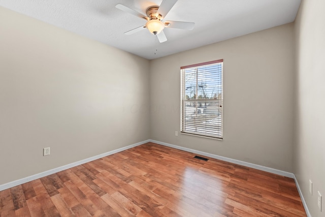 unfurnished room featuring ceiling fan and wood-type flooring